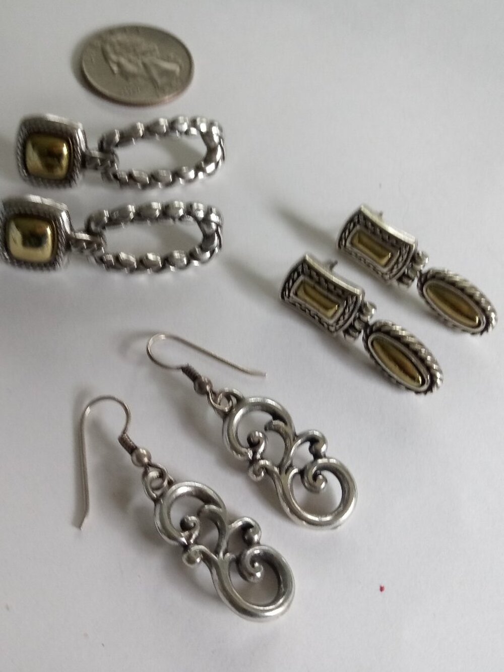 Brighton lot of pairs of two tone earrings in tin